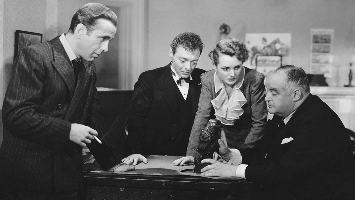Humphrey Bogart, Peter Lorre, Mary Astor, and Sydney Greenstreet in The Maltese Falcon