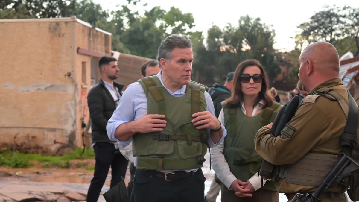 McCormick and his wife speak with IDF officials