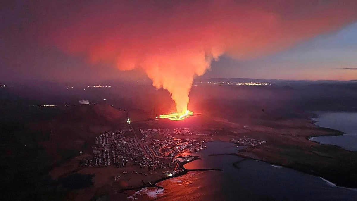 Iceland volcano erupts near town