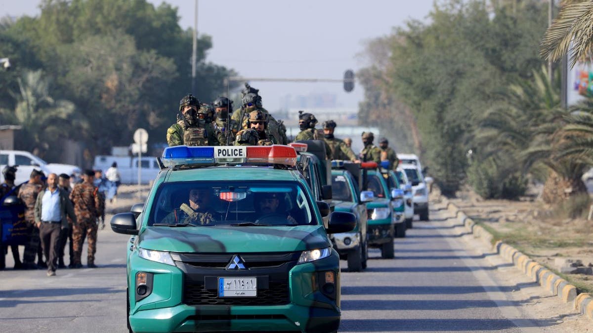 Iraqi security forces arrive to the site where Al-Nujaba senior commander Abu Taqwa Al-Saidi was killed