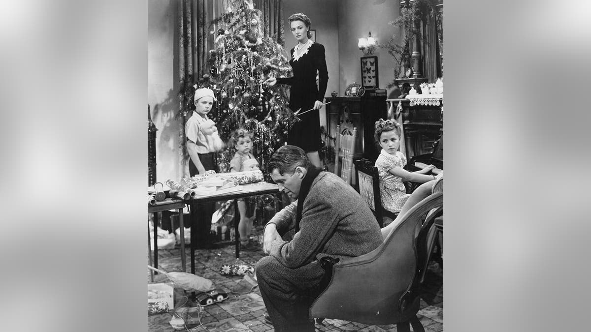 Black and white photo from "It's A Wonderful Life" with the Bailey family around a tree