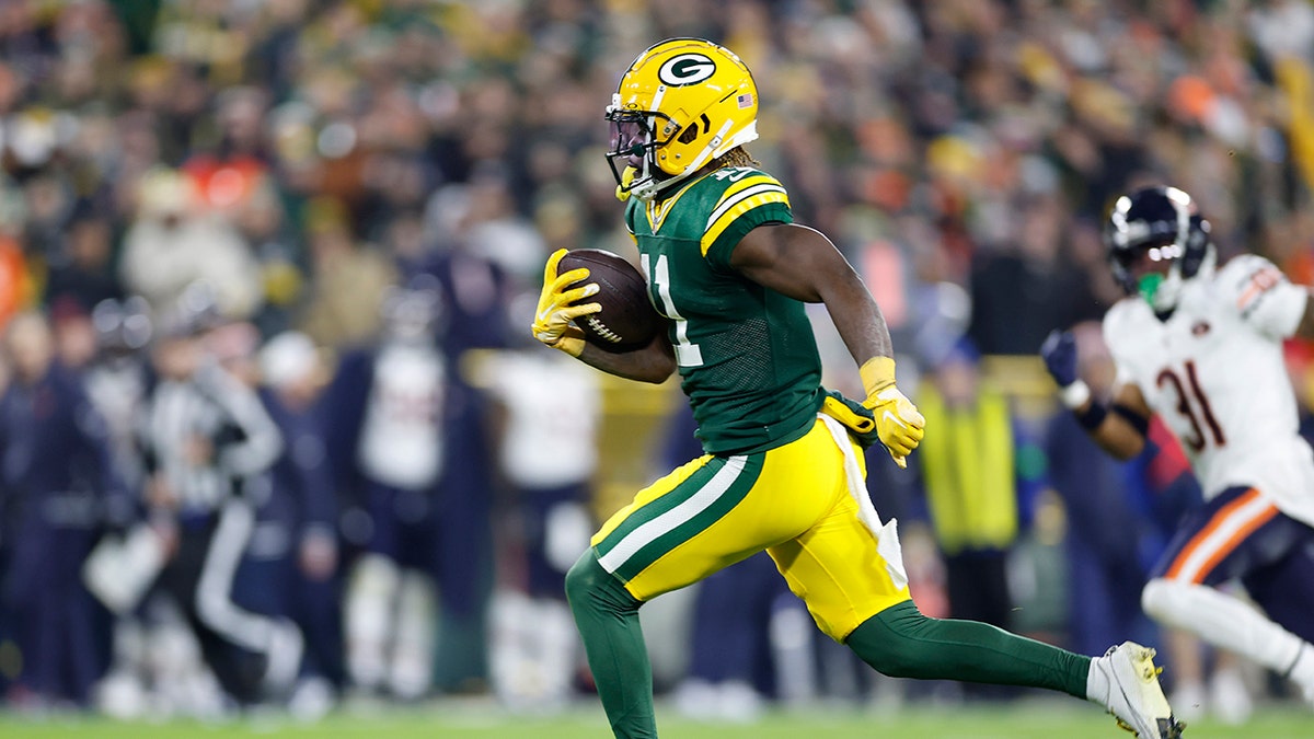 Packers secure final NFC playoff spot with win over Bears 1 Jayden Reed runs with ball