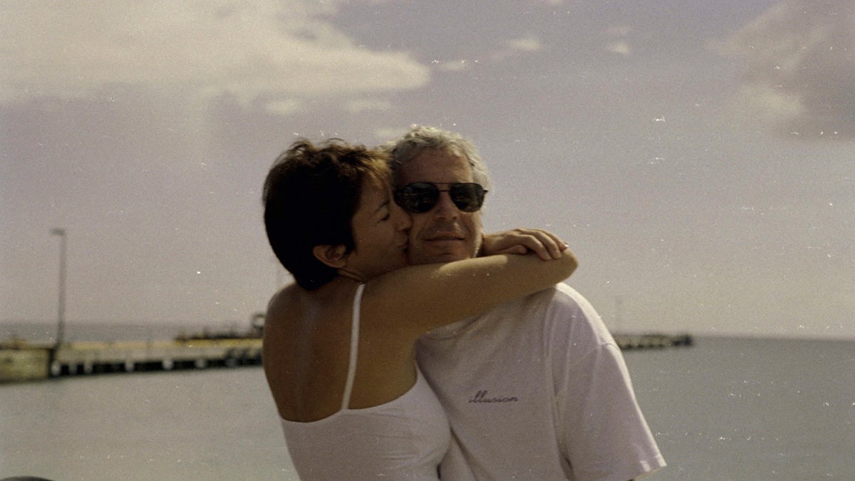 Ghislaine Maxwell and Jeffrey Epstein embrace for a photo