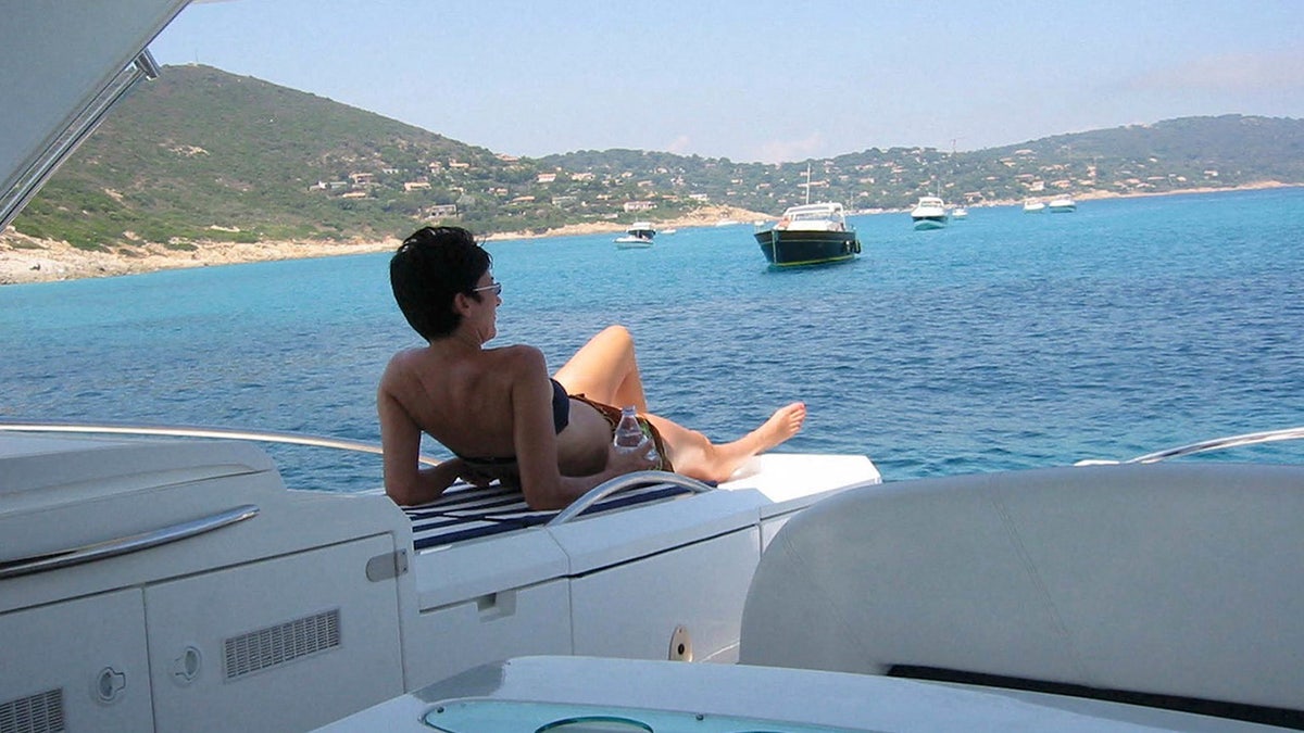 Ghislaine Maxwell sunbathes on a yacht