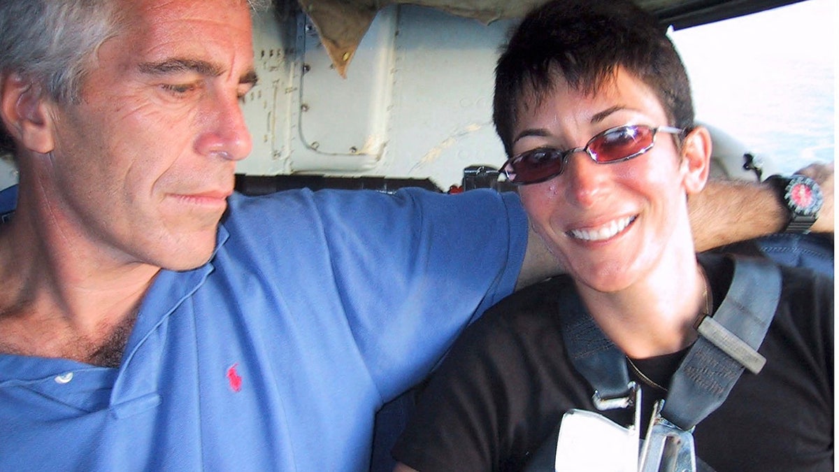 Ghislaine Maxwell and Jeffrey Epstein smile while onboard a helicopter