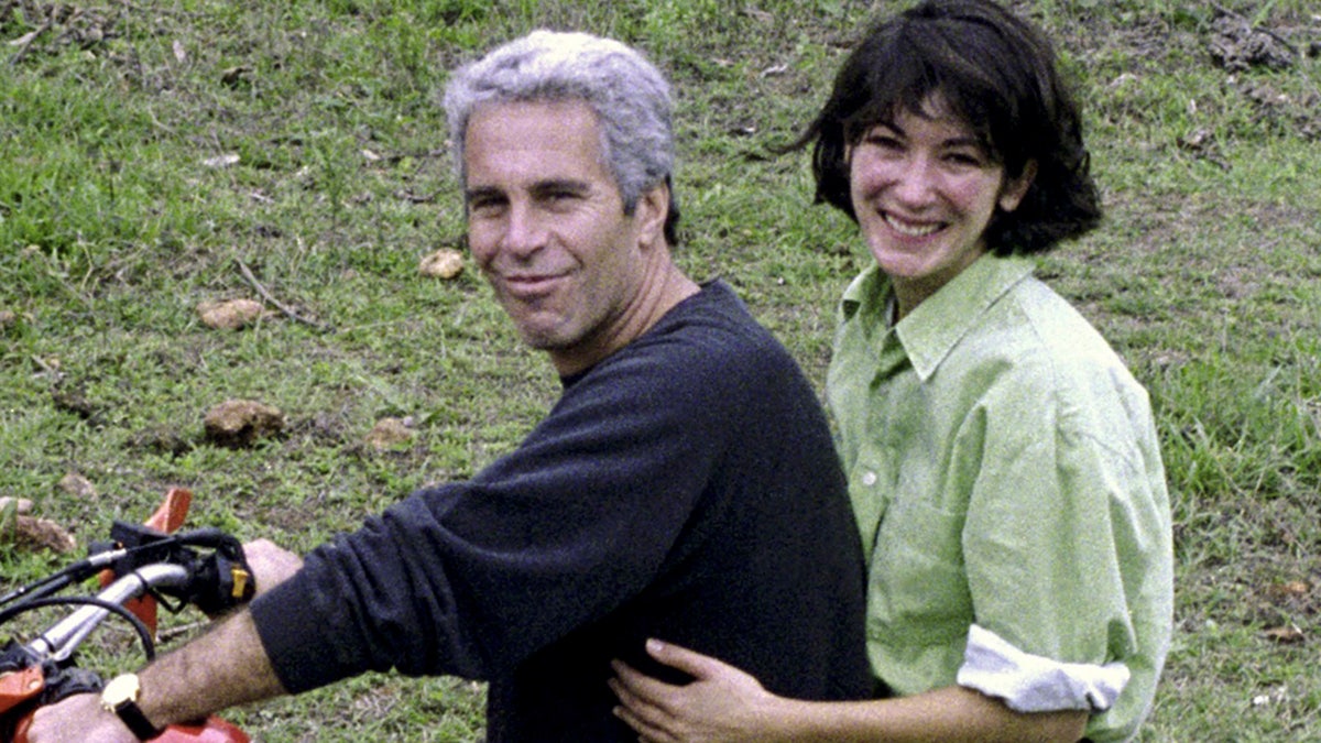 Ghislaine Maxwell and Jeffrey Epstein smile in this undated photograph