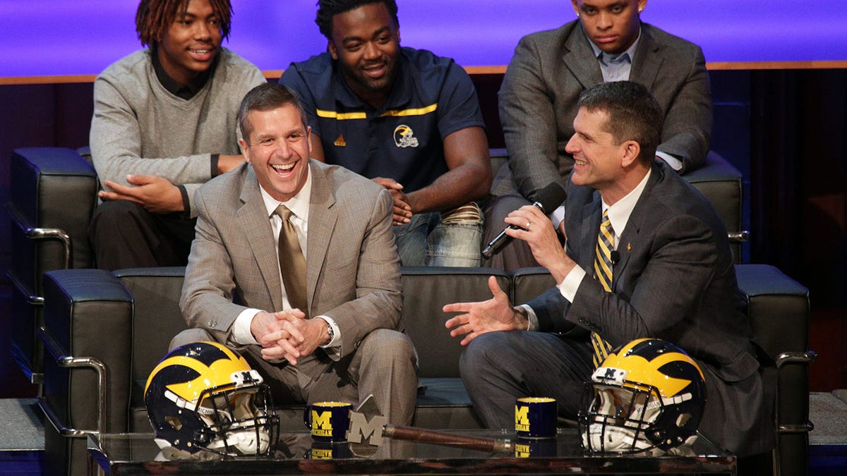 John and Jim Harbaugh attend an event