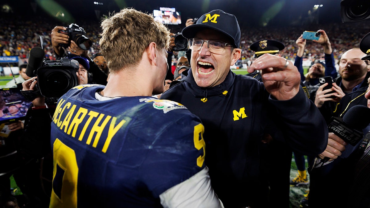 Jim Harbaugh and JJ McCarthy