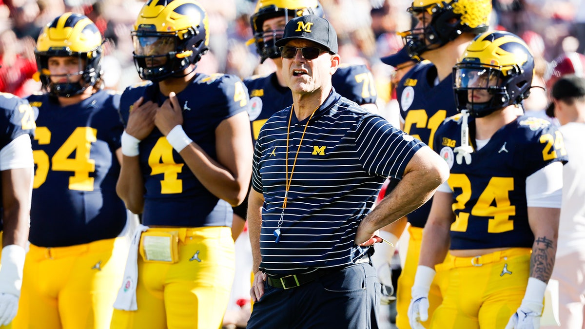 Jim Harbaugh leads his team