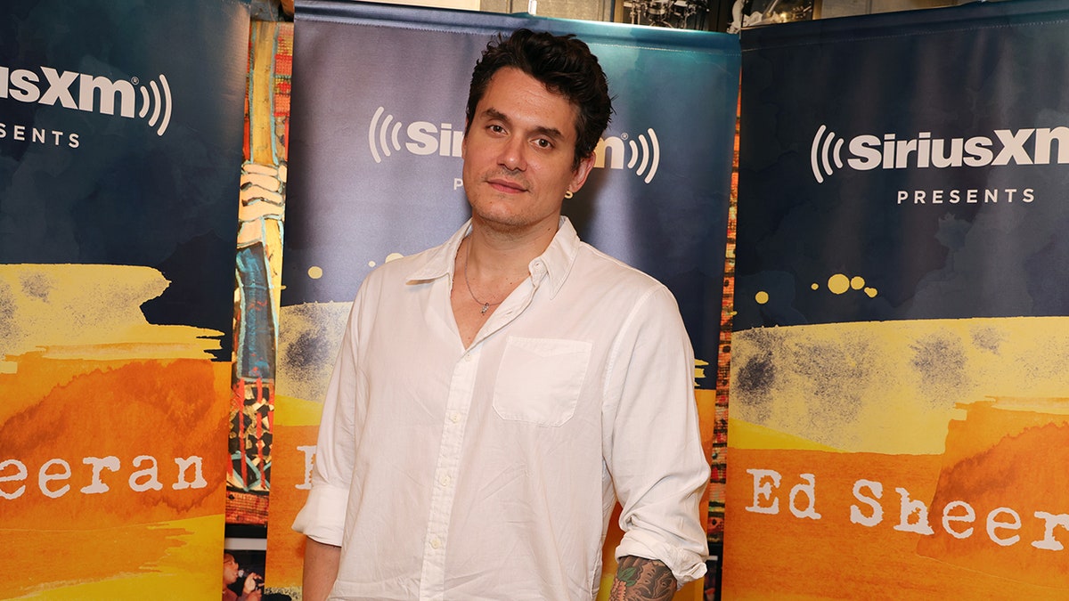 John Mayer posing on the red carpet