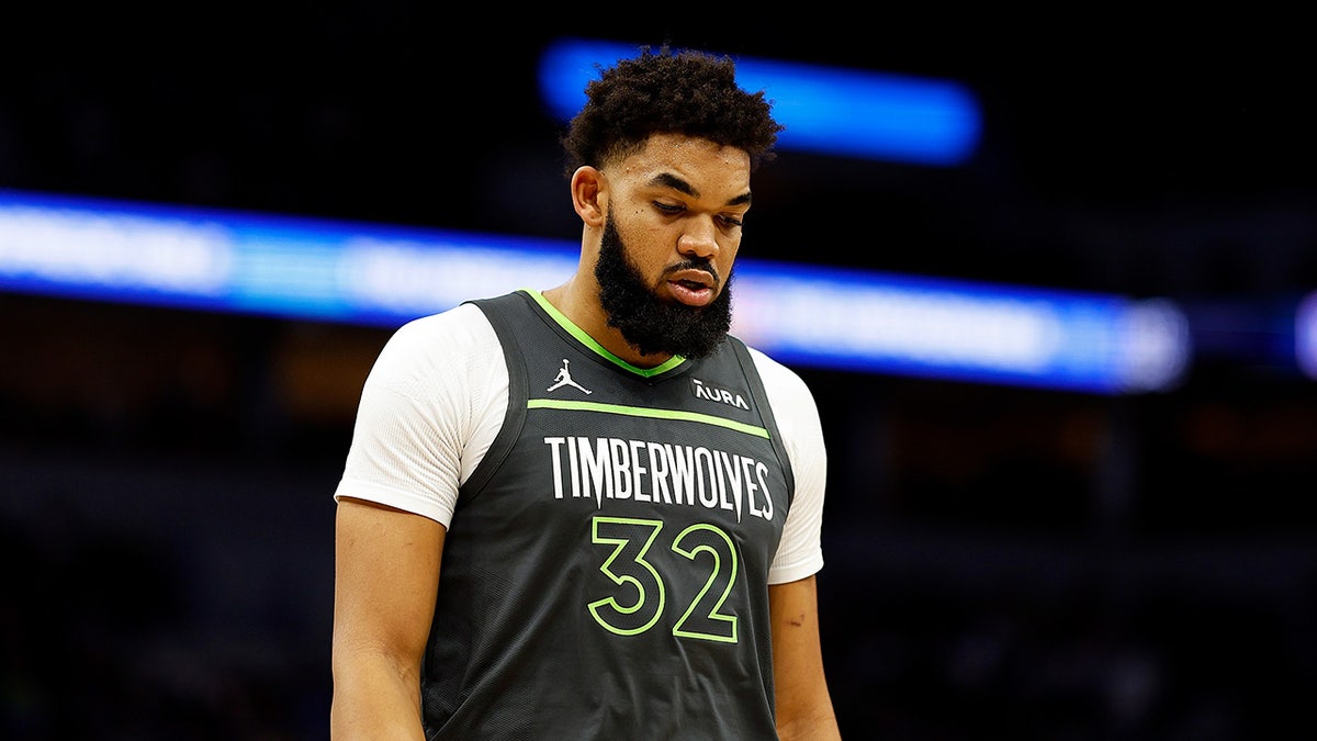 Karl-Anthony Towns looks down on court