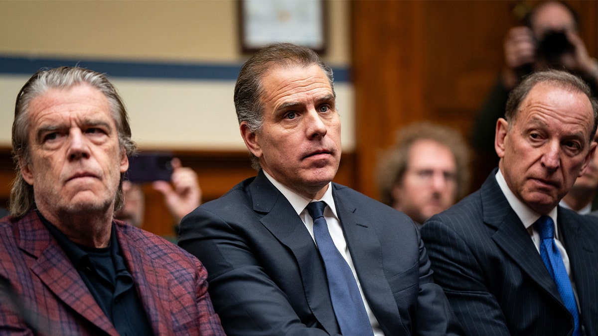 Hunter Biden, son of U.S. President Joe Biden, flanked by Kevin Morris, left, and Abbe Lowell, right, attend a House Oversight Committee meeting on January 10, 2024 in Washington, DC. The committee is meeting today as it considers citing him for Contempt of Congress.