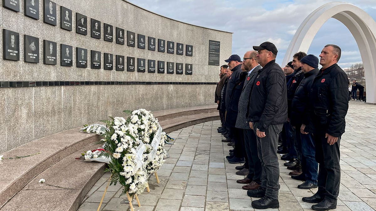Kosovo memorial spectators