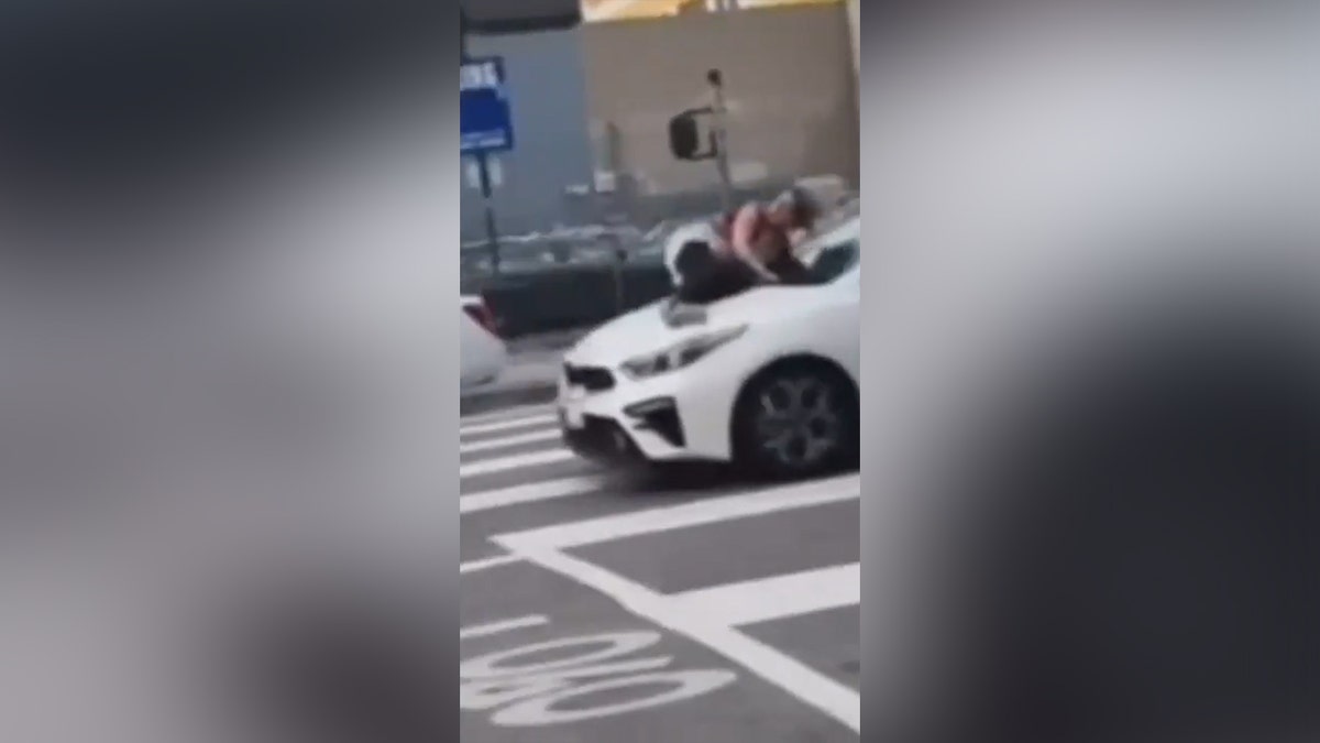 Los Angeles car with woman on hood