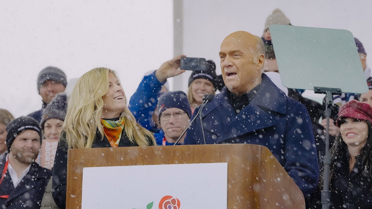 Pastor Greg Laurie and his wife at a podium