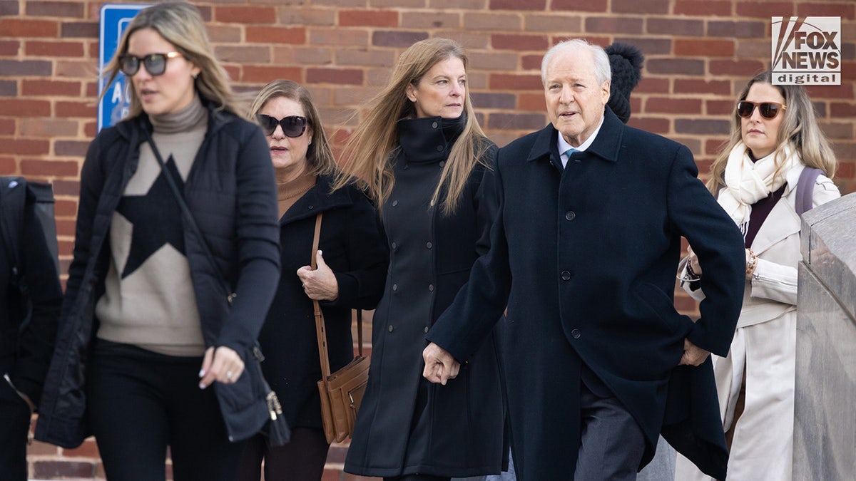 Michelle Troconis arrives alongside her family at the Stamford Superior Court