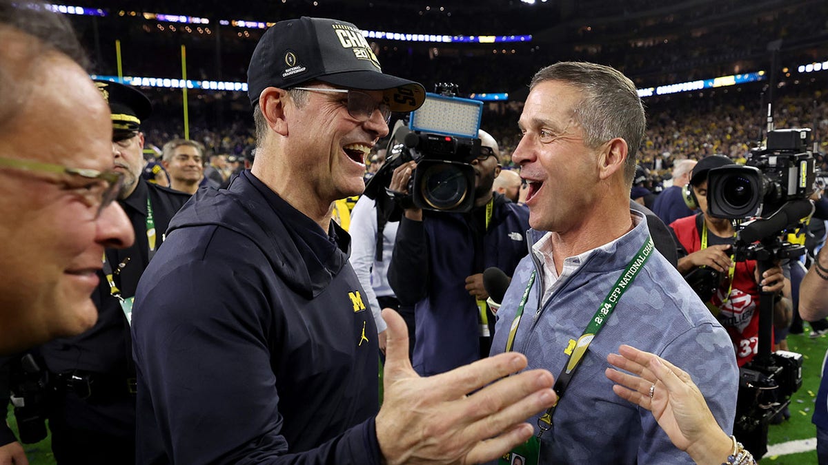 Jim Harbaugh celebrates with his brother
