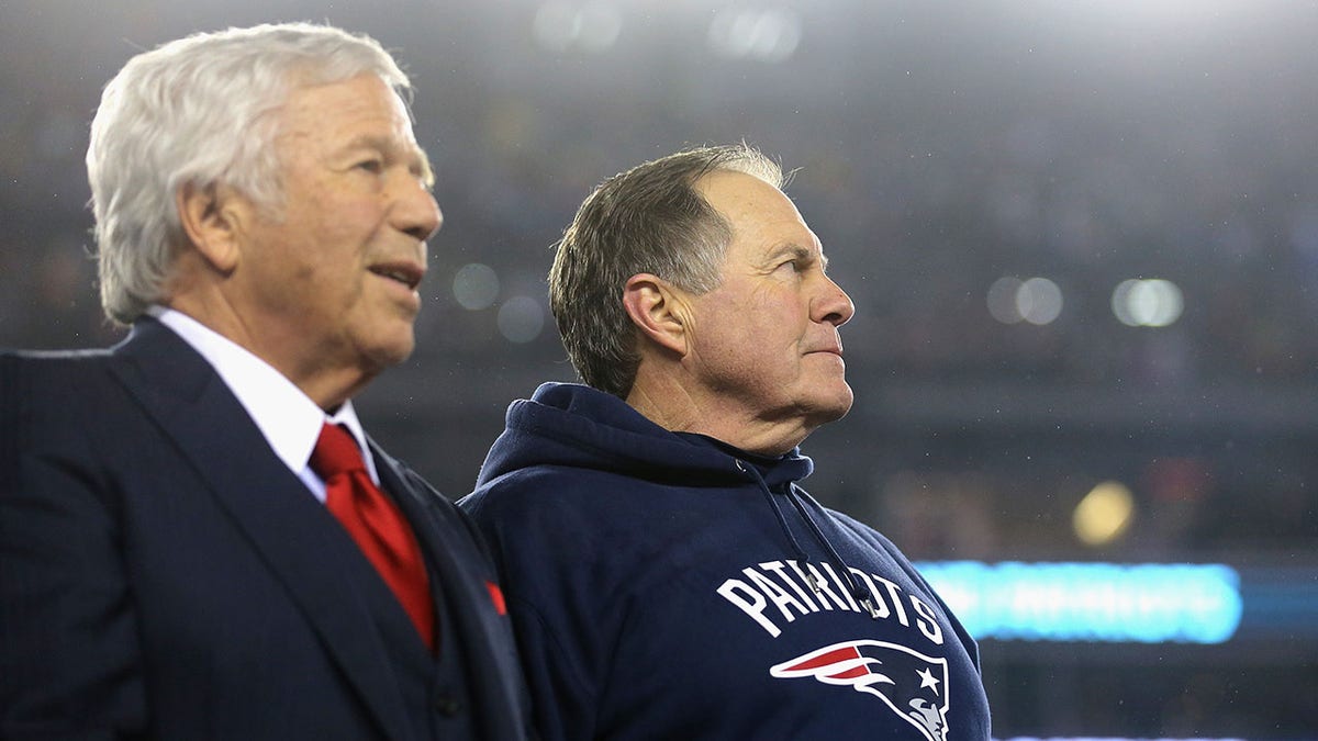 Robert Kraft and Bill Belichick look on after a game