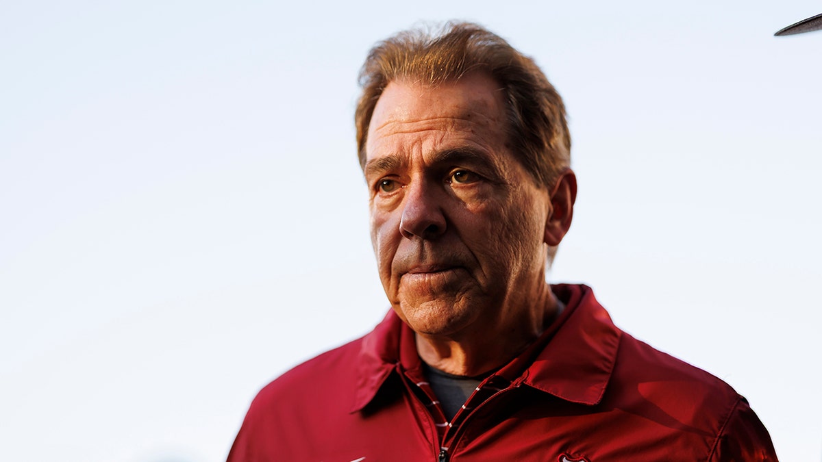 Nick Saban stares on the field