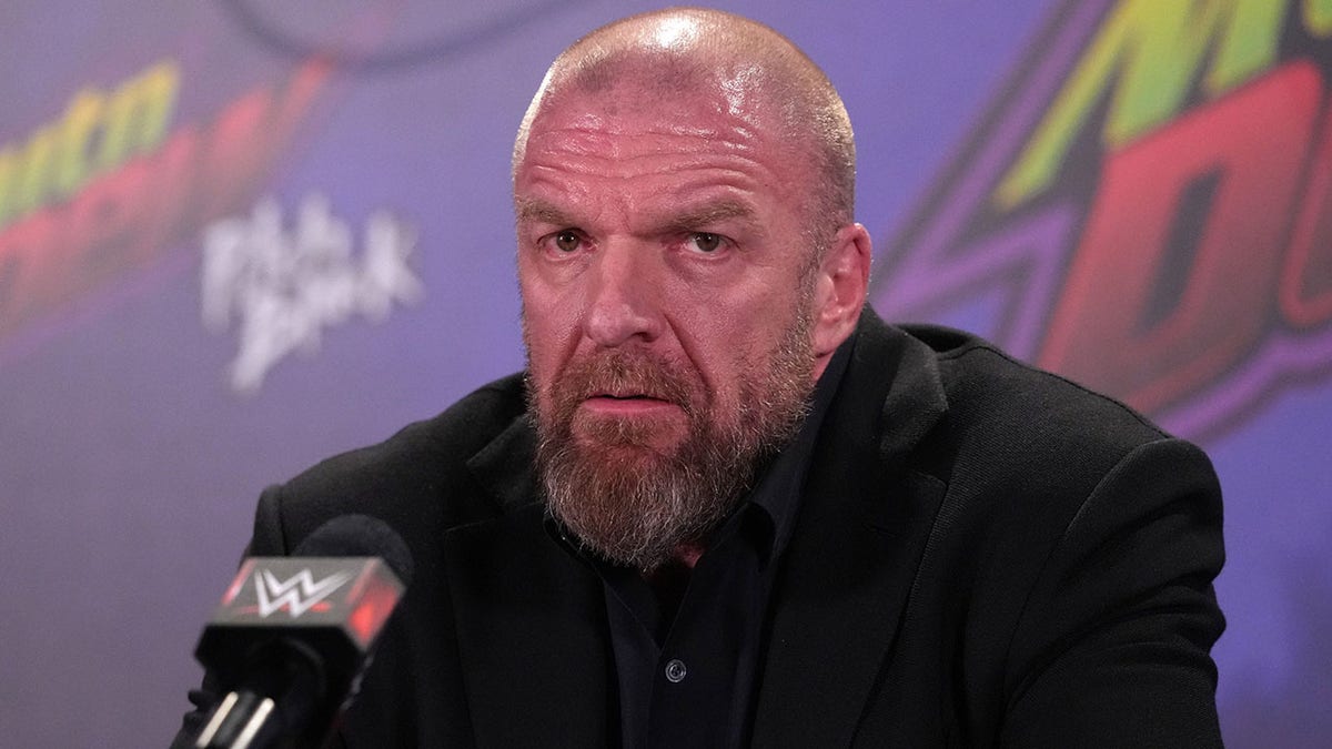 Triple H talks to reporters