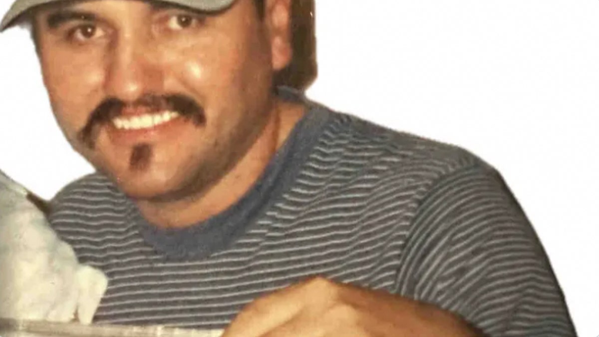 Pedro Barrera has a mustache and striped shirt in a blurry photo