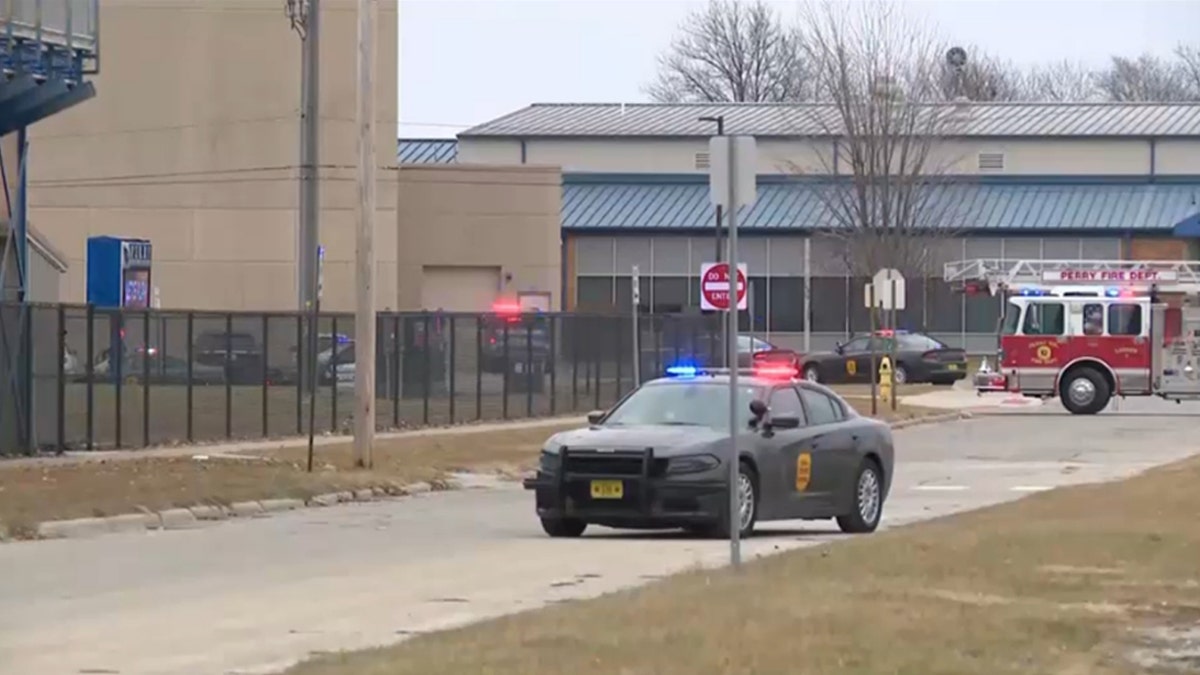 Police vehicle parked outside Perry High School