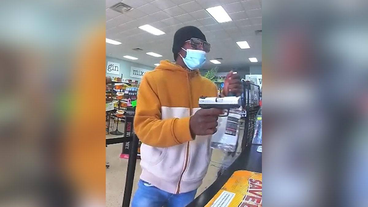 Gunman aims pistiol at liquor store clerk during Oklahoma City robbery