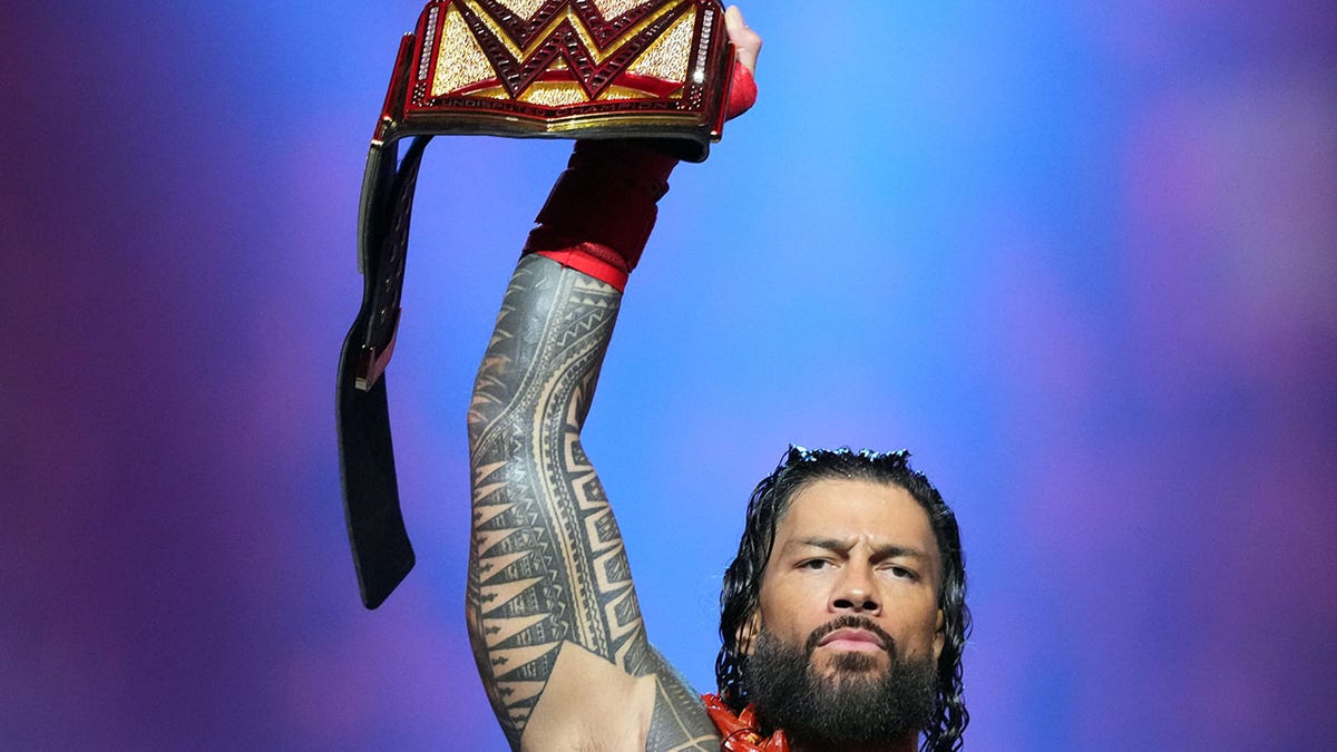 Roman Reigns with the title