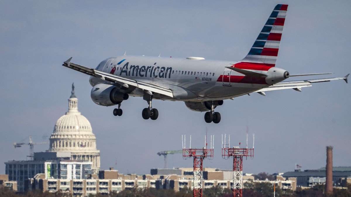 An American Airlines plane lands at Ronald Reagan Washington National Airport in November 2021 in Arlington, Virginia.
