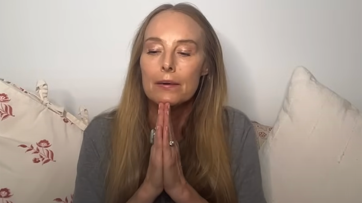 Chynna Phillips puts her hands together in prayer during her YouTube video