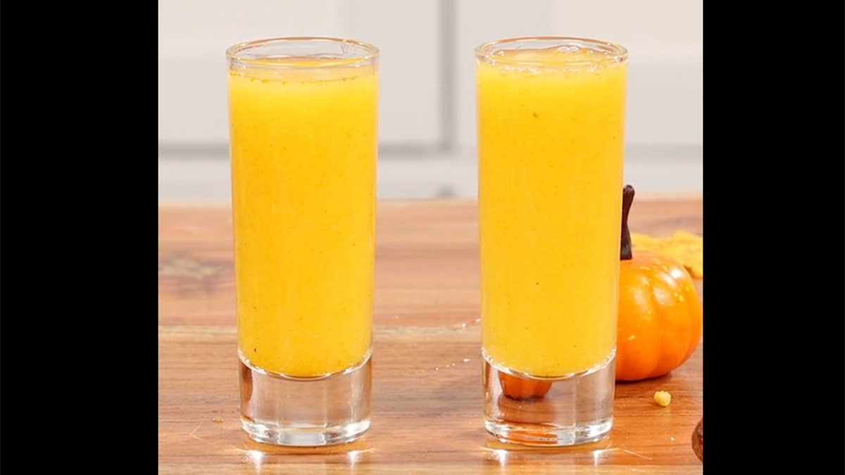two shooters with orange drinks