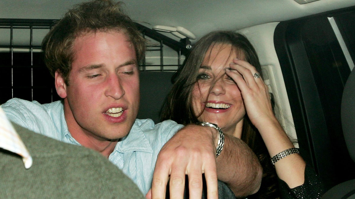 Kate Middleton smiling with Prince William appearing tipsy inside a car outside a nightclub