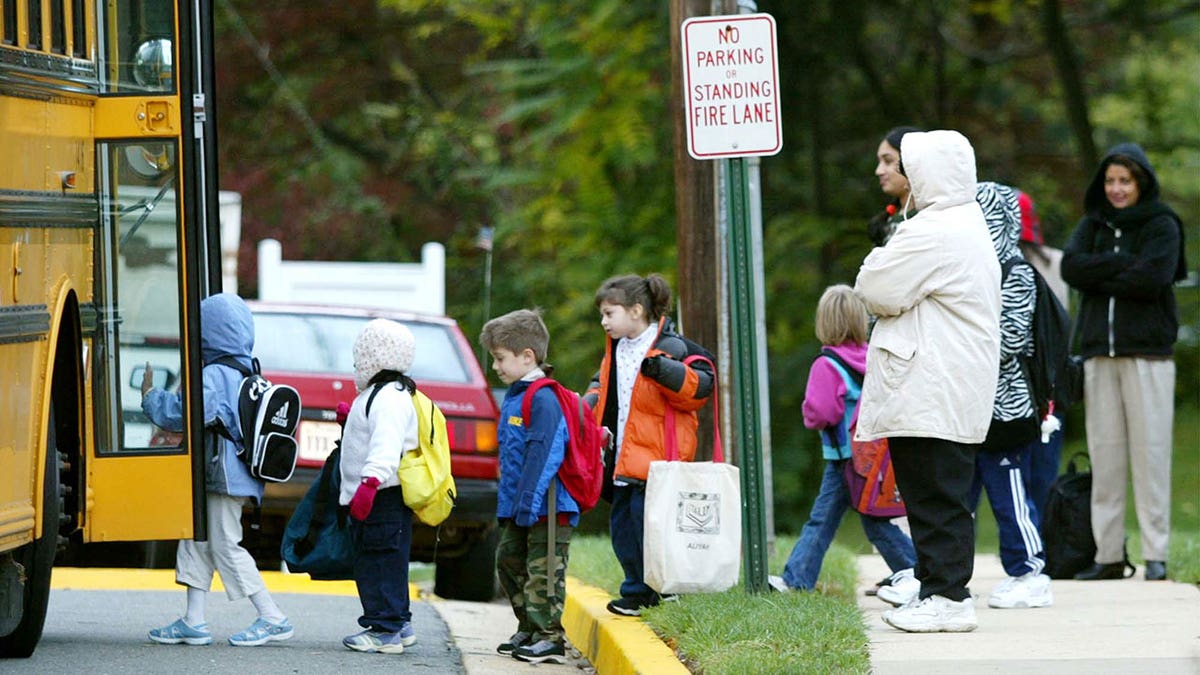 Children step onto school bus