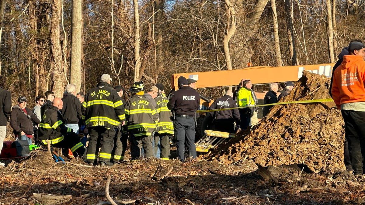 Emergency crews attend the scene where a worker died