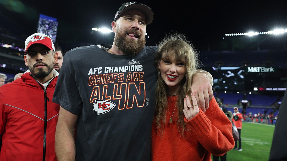 Travis Kelce smiles with Taylor Swift
