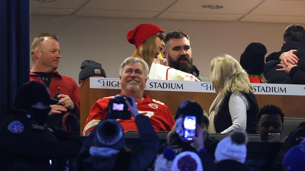 Taylor Swift standing next to Jason Kelce in VIP suite