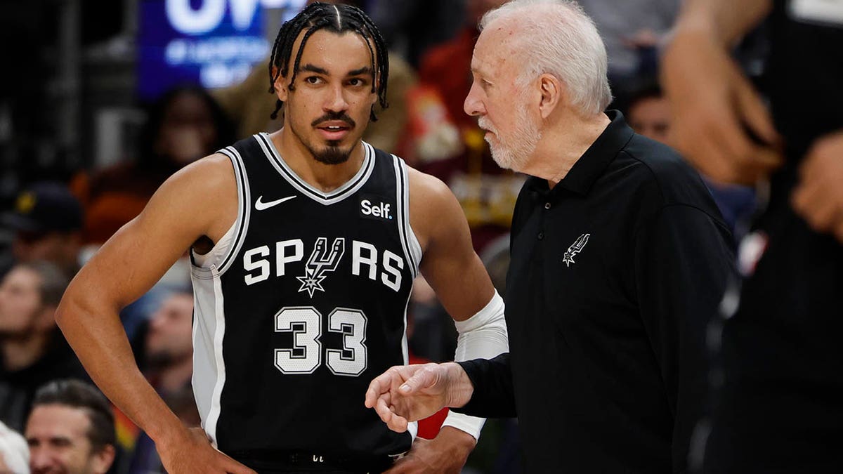 Tre Jones and Gregg Popovich