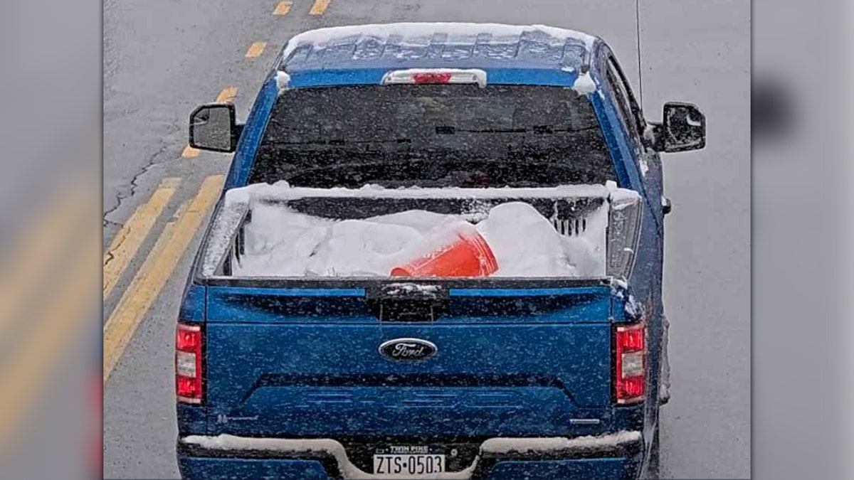 Blue Ford truck driving