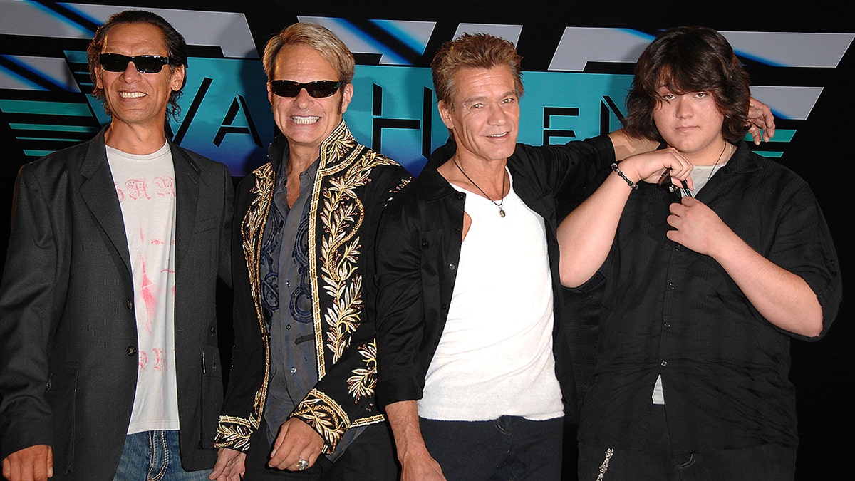 Alex Van Halen, David Lee Roth, Eddie Van Halen, and Wolfgang Van Halen posing together