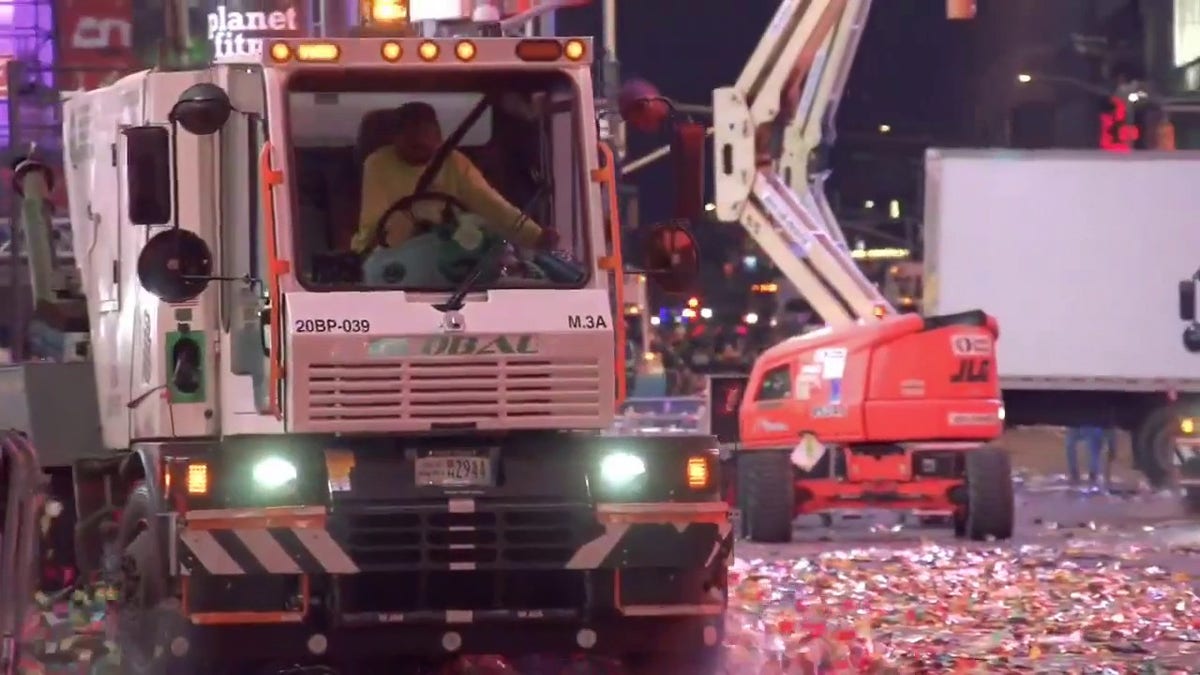 Clean up crews in Times Square after NYE celebration