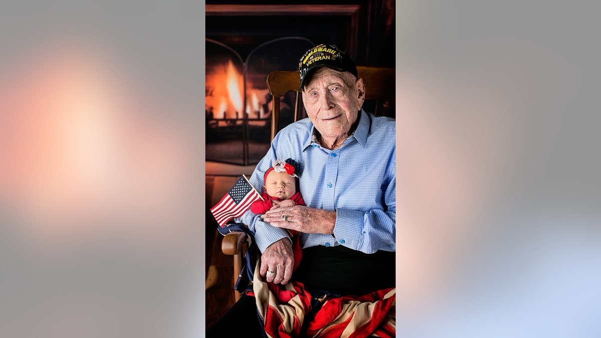 WWII vet holding great great grandaughter