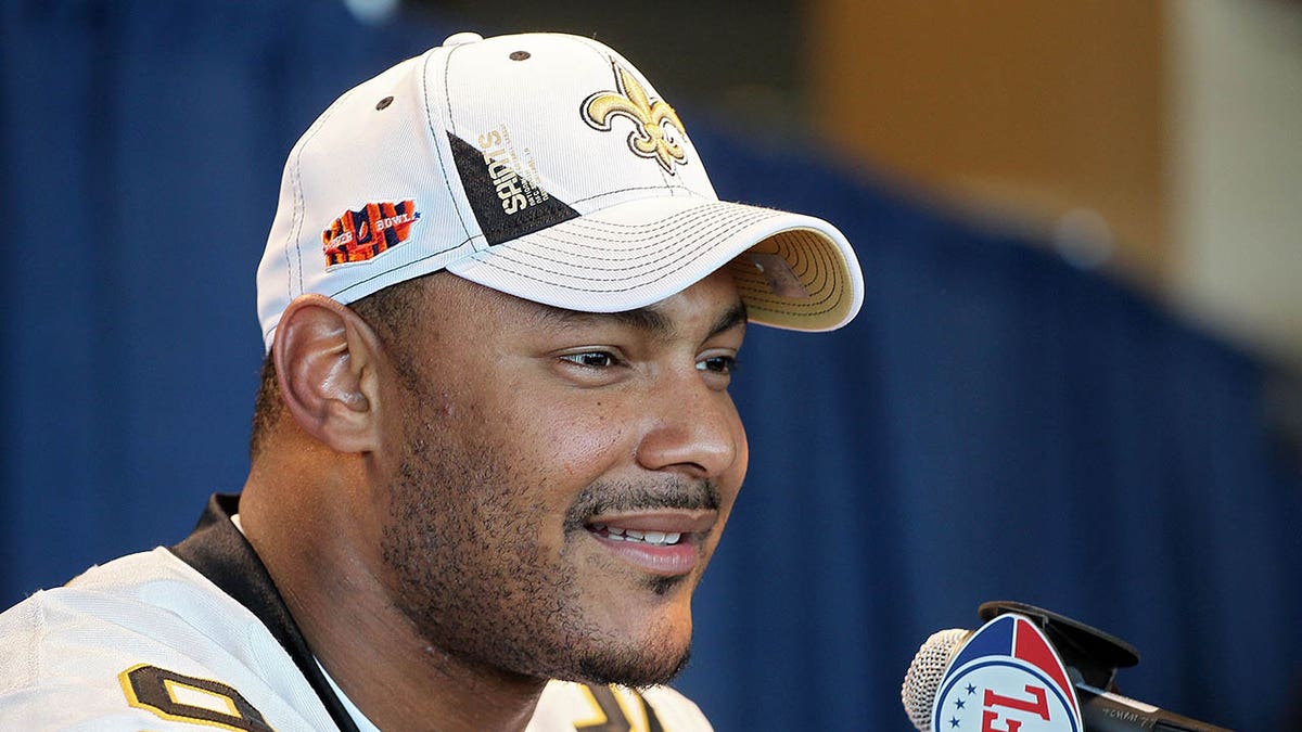 Saints player Will Smith speaks to the media