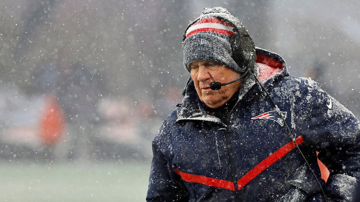 Bill Belichick stands on the sidelines
