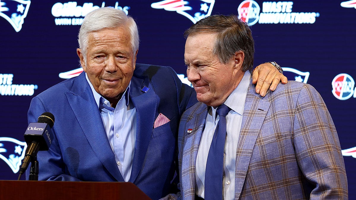 Robert Kraft embraces Bill Belichick