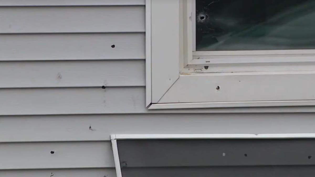 Close-up of bullet holes at Chicago home