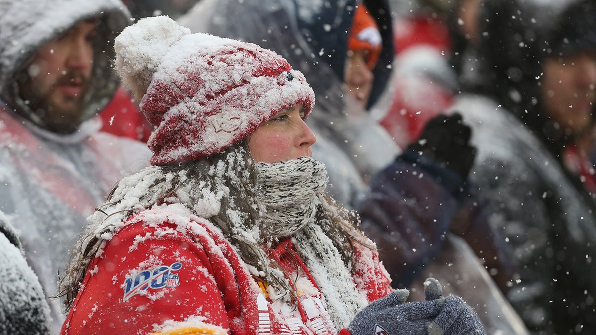 A Kansas City Chiefs fan covered in snow