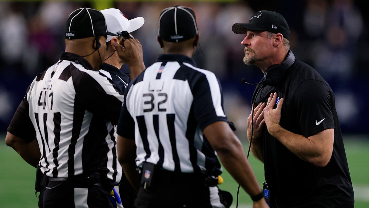 Dan Campbell with refs