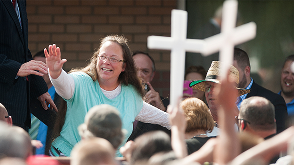 GRAYSON, KY - SEPTEMBER 8: Rowan County Clerk of Courts Kim Davis waves to a crowd of her supporters at a rally in front of the Carter County Detention Center on September 8, 2015 in Grayson, Kentucky. Davis was ordered to jail last week for contempt of court after refusing a court order to issue marriage licenses to same-sex couples.