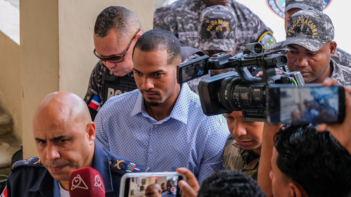 Wander Franco being escorted by police into court