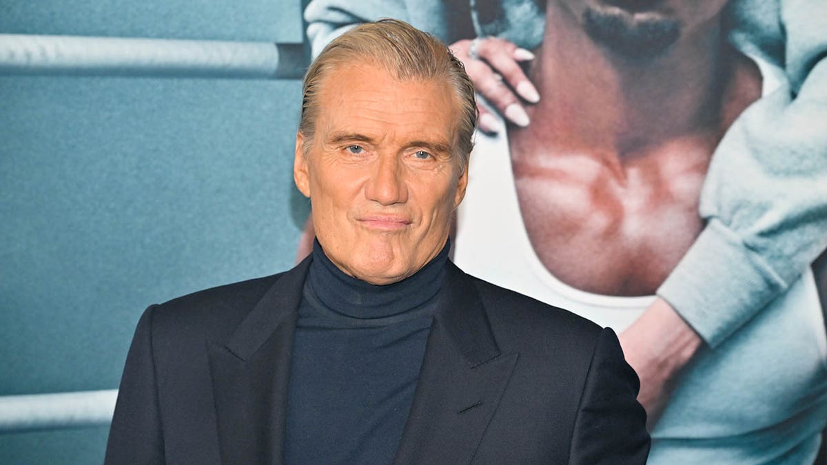 dolph lundgren looking serious on red carpet